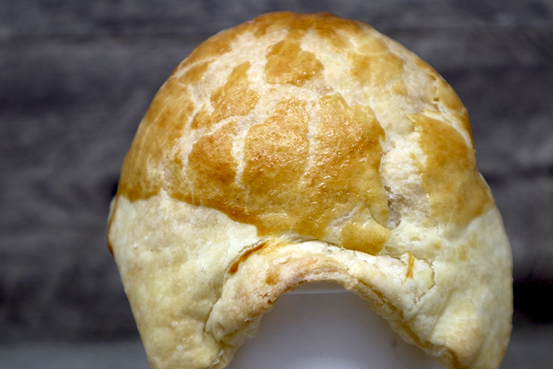 A flaky golden-brown puff pastry pot pie.