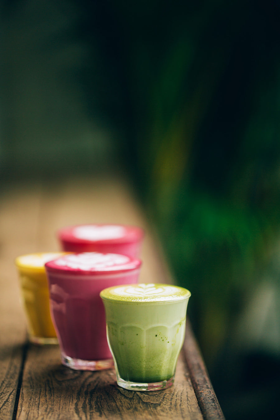 A collection of drinks arranged in a row